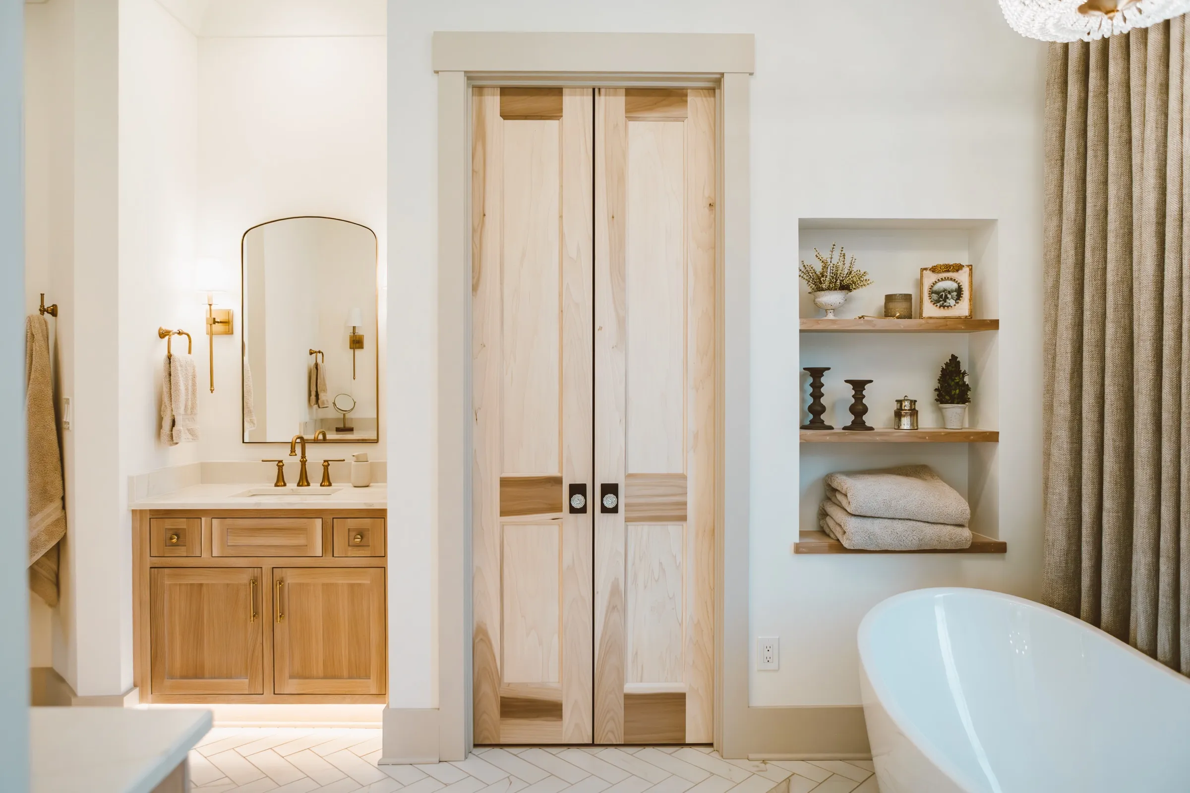 Primary bath with poplar pocket doors and a freestanding tub