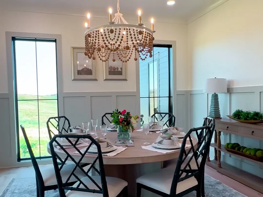 Dining room with a beaded chandelier and views to the fields