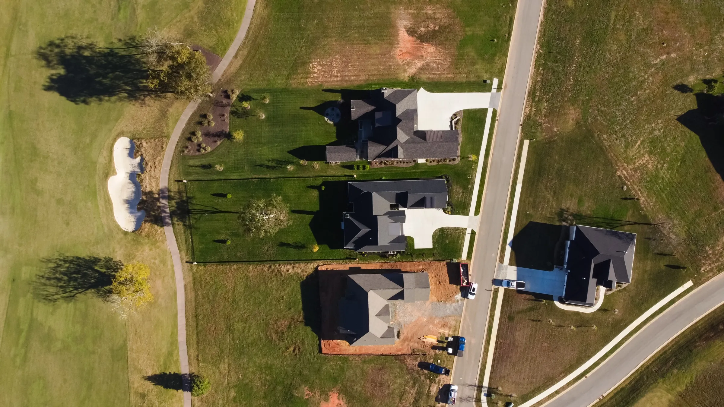Aerial view of the Fairway Residence at the edge of the golf course