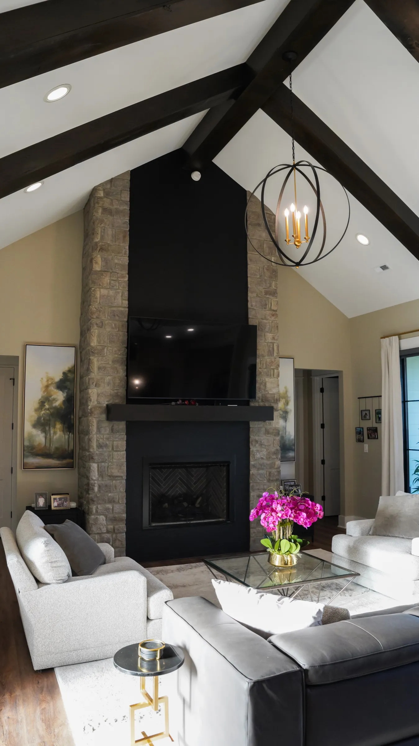 Great room fireplace with vaulted beamed ceiling