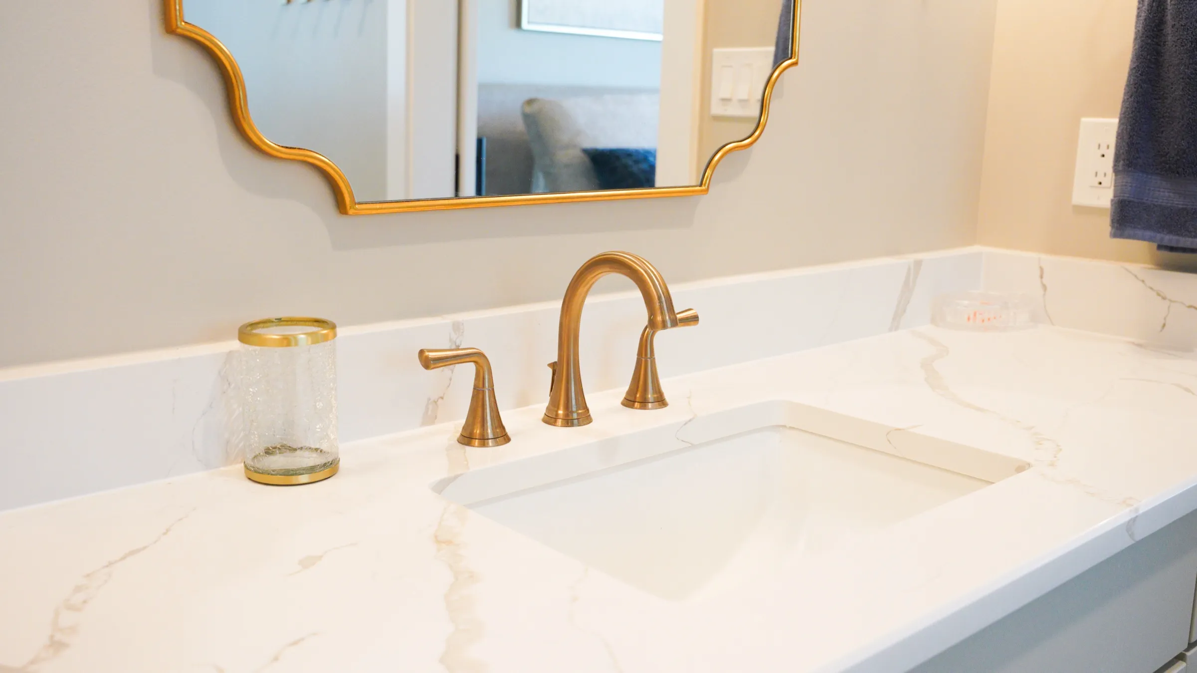 Bathroom vanity with brass fixtures