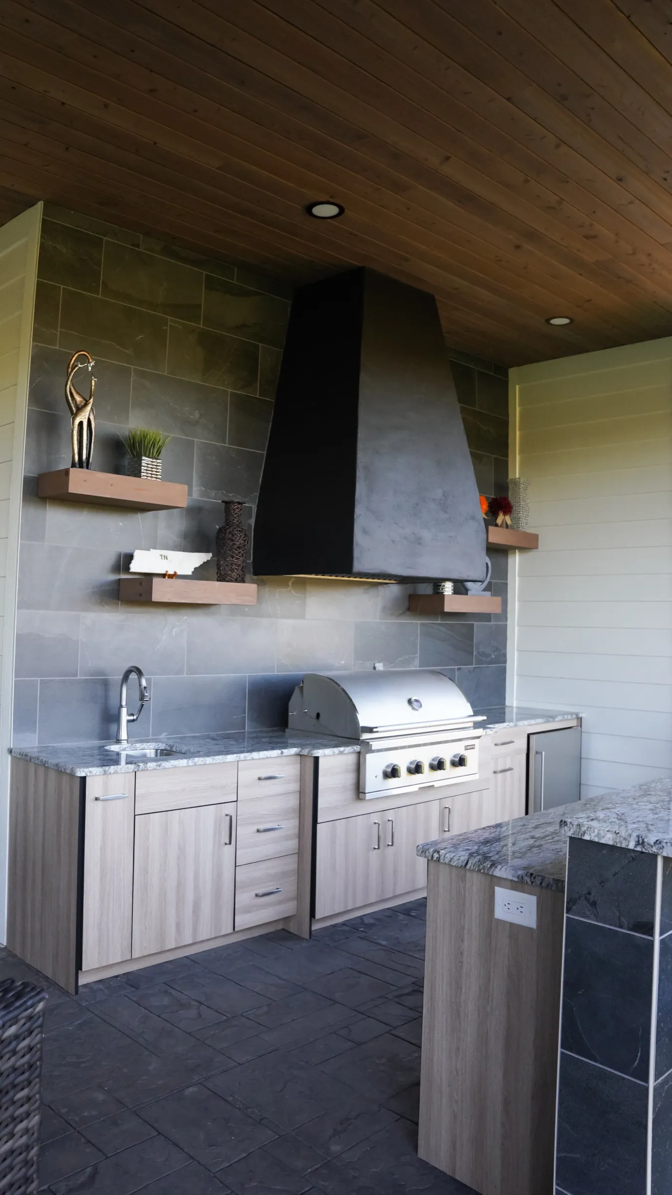 Outdoor kitchen under the covered porch